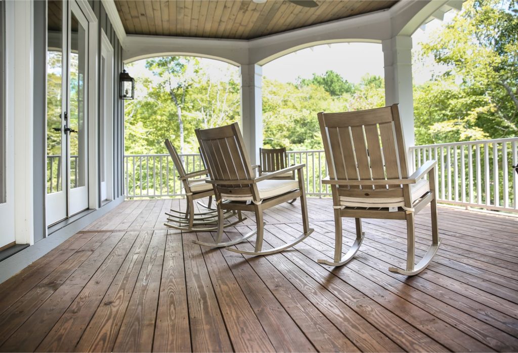 a view from a wooden porch with rocking chairs in Pendleton South Carolina.